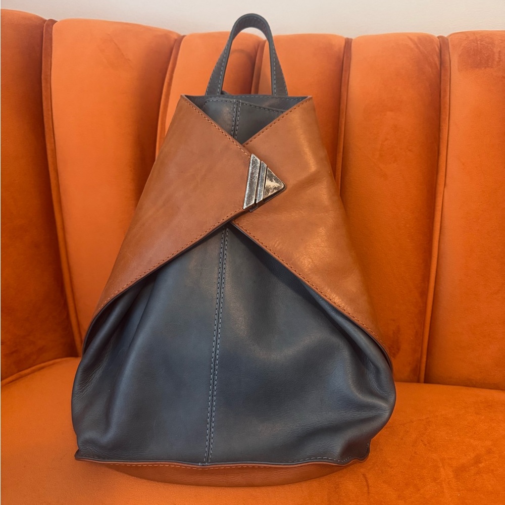 Blue and tan leather backpack